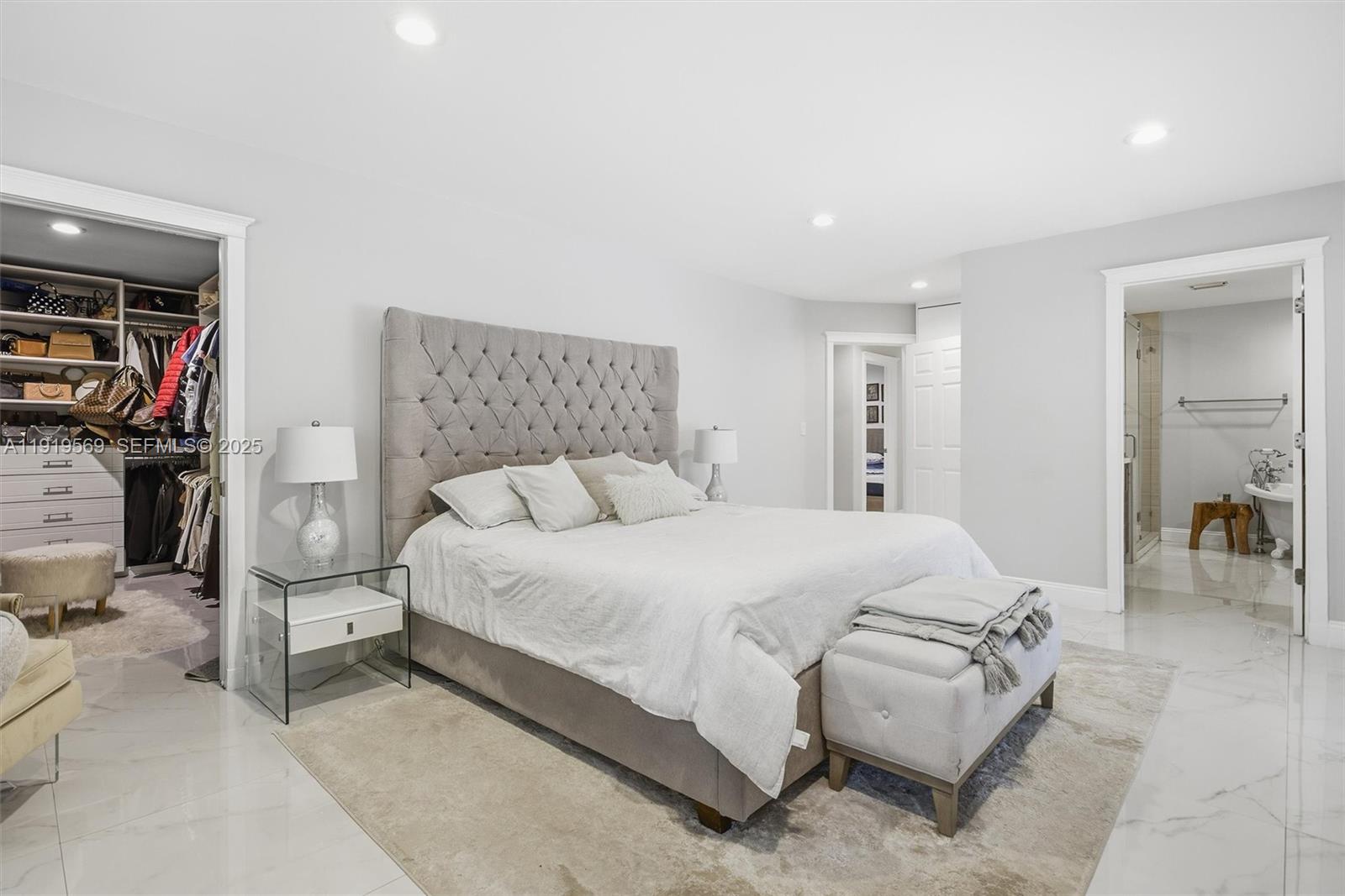 5601 Southwest 195th Terrace Southwest Ranches, FL 33332 - Photo 29 of 84 a spacious bedroom with a bed and a couch