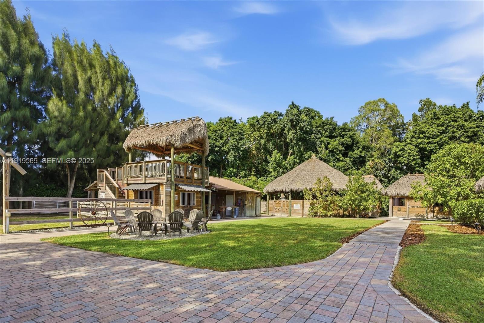 5601 Southwest 195th Terrace Southwest Ranches, FL 33332 - Photo 3 of 84 a view of house with outdoor space and garden