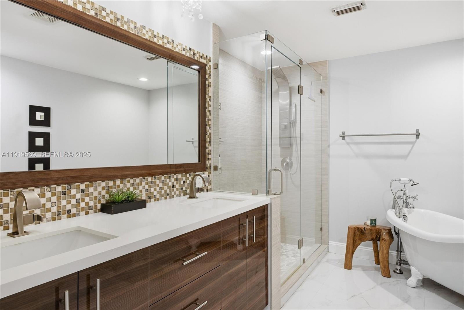 5601 Southwest 195th Terrace Southwest Ranches, FL 33332 - Photo 31 of 84 a bathroom with a double vanity sink mirror and double
