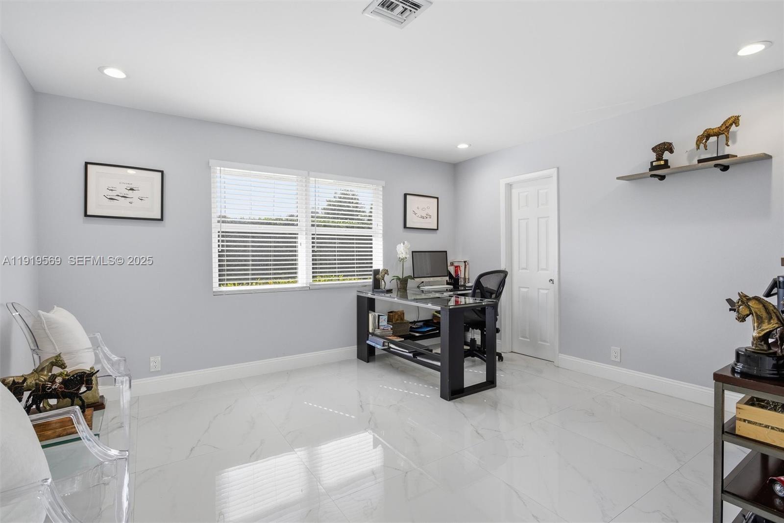 5601 Southwest 195th Terrace Southwest Ranches, FL 33332 - Photo 33 of 84 a living room with furniture and a window