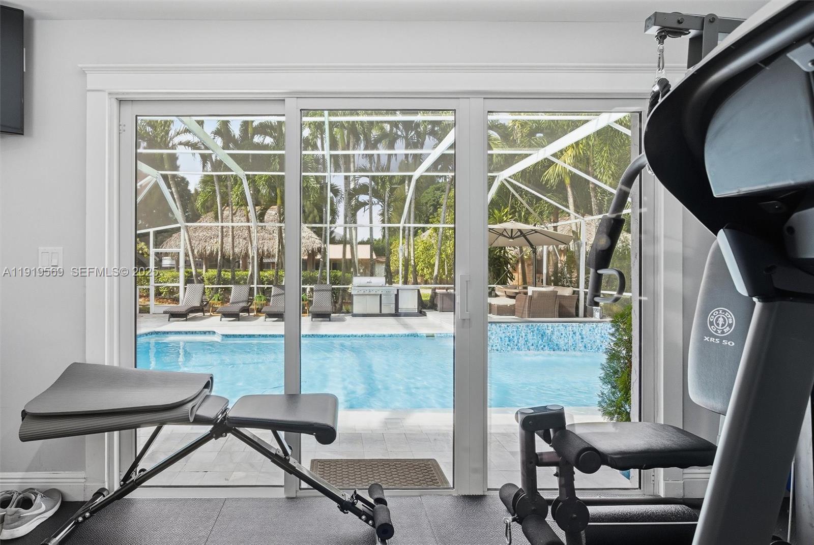 5601 Southwest 195th Terrace Southwest Ranches, FL 33332 - Photo 42 of 84 a view of a room with a large window and chair