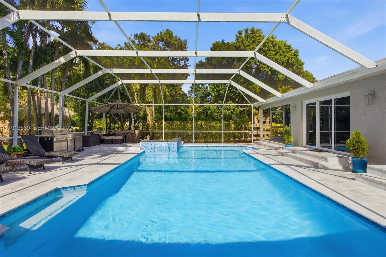 5601 Southwest 195th Terrace Southwest Ranches, FL 33332 - Photo 44 of 84 a view of a house with a swimming pool