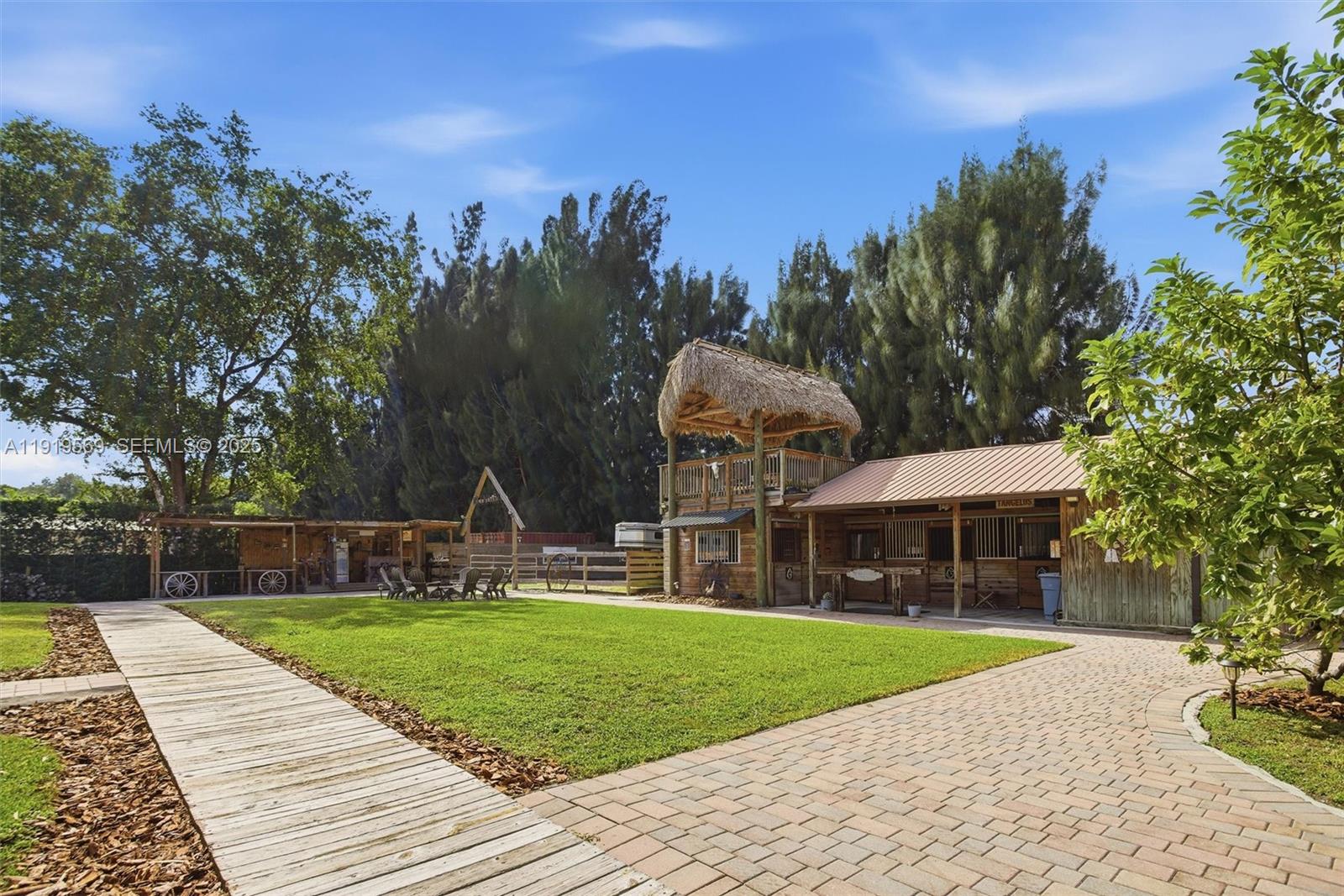 5601 Southwest 195th Terrace Southwest Ranches, FL 33332 - Photo 53 of 84 a view of outdoor space yard deck patio and swimming pool