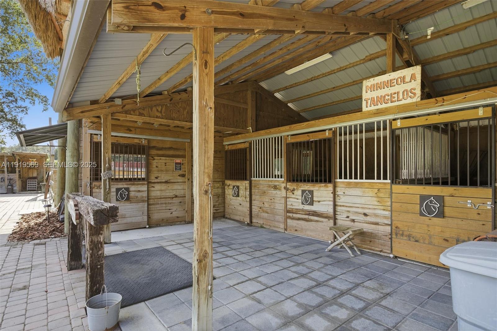 5601 Southwest 195th Terrace Southwest Ranches, FL 33332 - Photo 58 of 84 a view of a porch with a table and chairs