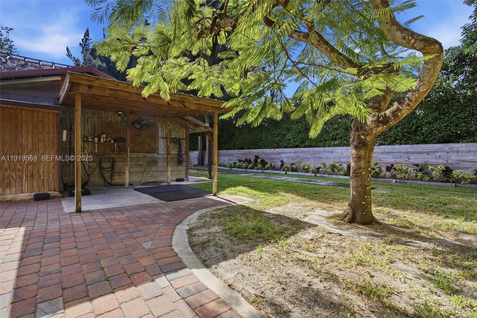 5601 Southwest 195th Terrace Southwest Ranches, FL 33332 - Photo 59 of 84 a view of a house with a yard