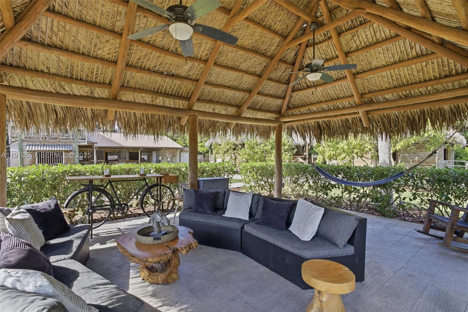 5601 Southwest 195th Terrace Southwest Ranches, FL 33332 - Photo 66 of 84 a outdoor living space with furniture and garden view