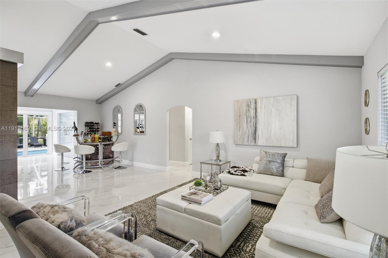 5601 Southwest 195th Terrace Southwest Ranches, FL 33332 - Photo 10 of 84 a living room with furniture and white wooden floor
