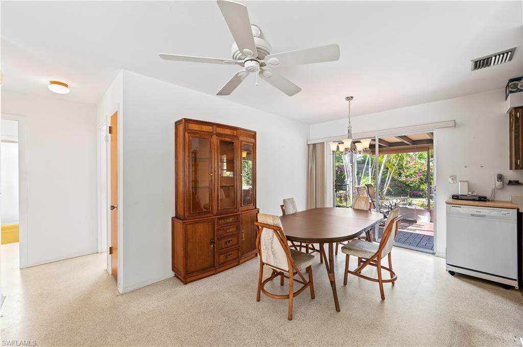 4815 Cortez Circle Naples, FL 34112 - Photo 11 of 31 a dining room with furniture and window