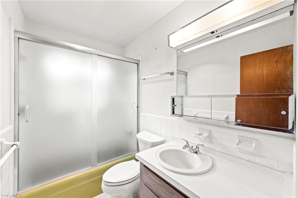 4815 Cortez Circle Naples, FL 34112 - Photo 22 of 31 a bathroom with a sink toilet and shower