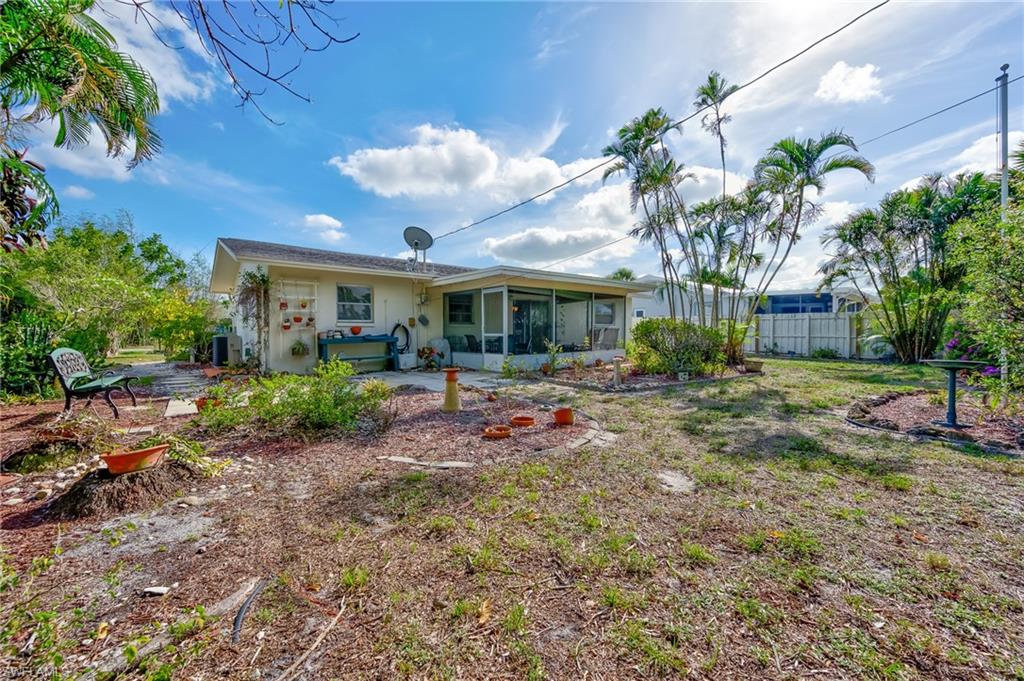 4815 Cortez Circle Naples, FL 34112 - Photo 30 of 31 a view of a house with backyard and garden