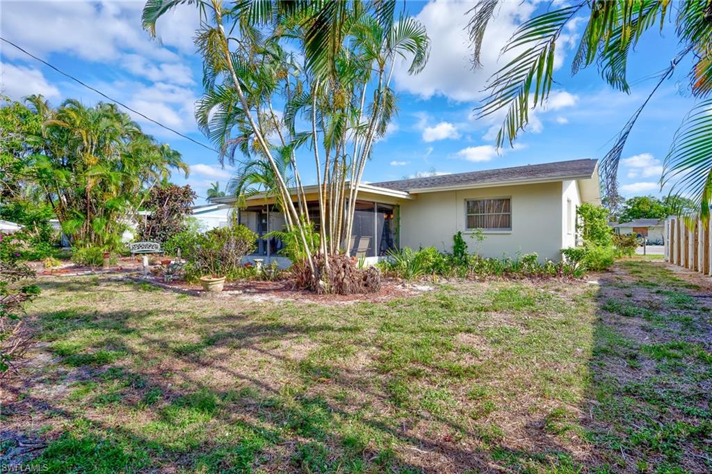 4815 Cortez Circle Naples, FL 34112 - Photo 31 of 31 a view of a house with a yard and tree s