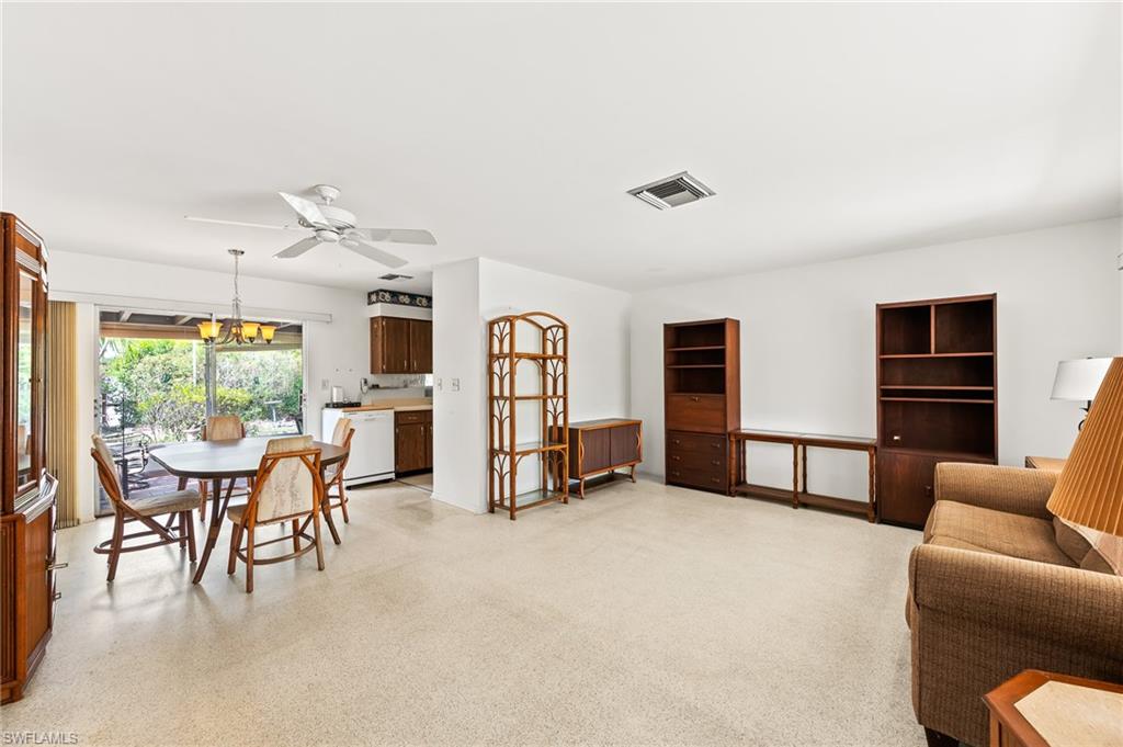4815 Cortez Circle Naples, FL 34112 - Photo 5 of 31 a view of a livingroom with furniture and windows