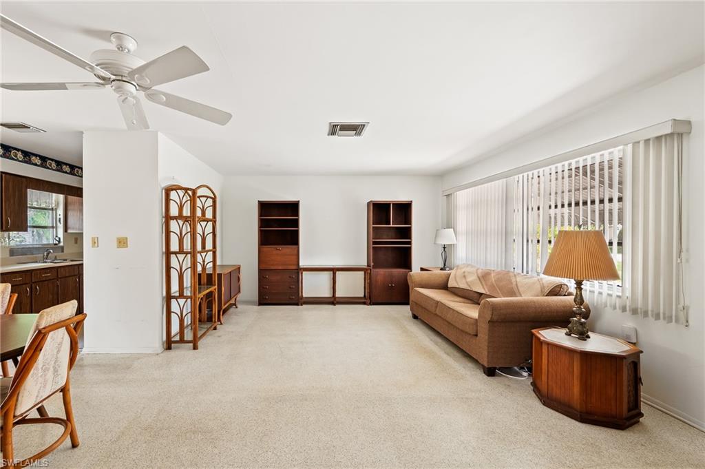 4815 Cortez Circle Naples, FL 34112 - Photo 6 of 31 a living room with furniture and a window