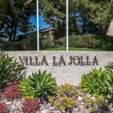 a view of a sign board with flower in front of it