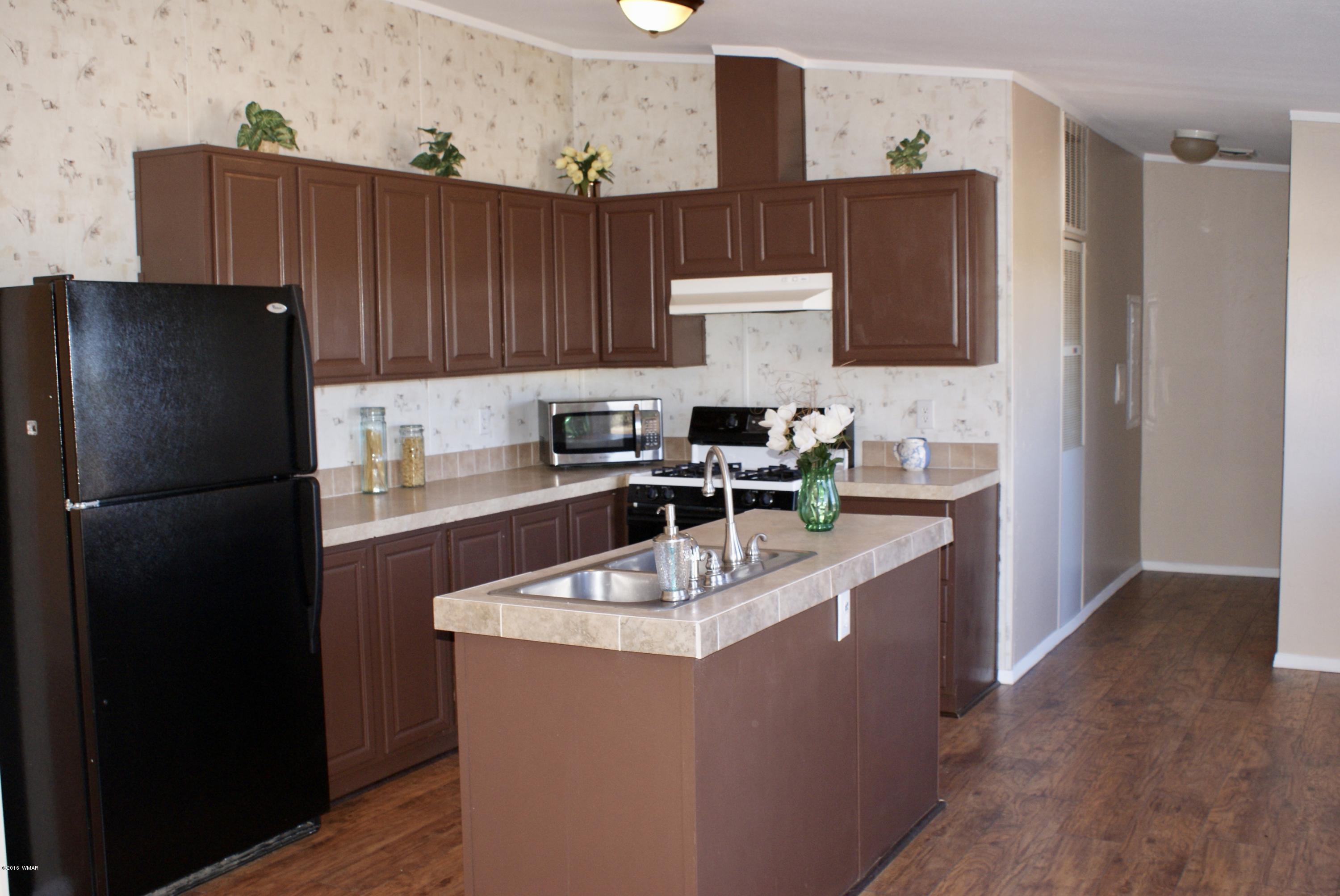 Lot 66 Antelope Vernon, AZ 85940 - Photo 5 of 17 a kitchen with stainless steel appliances a refrigerator and a sink