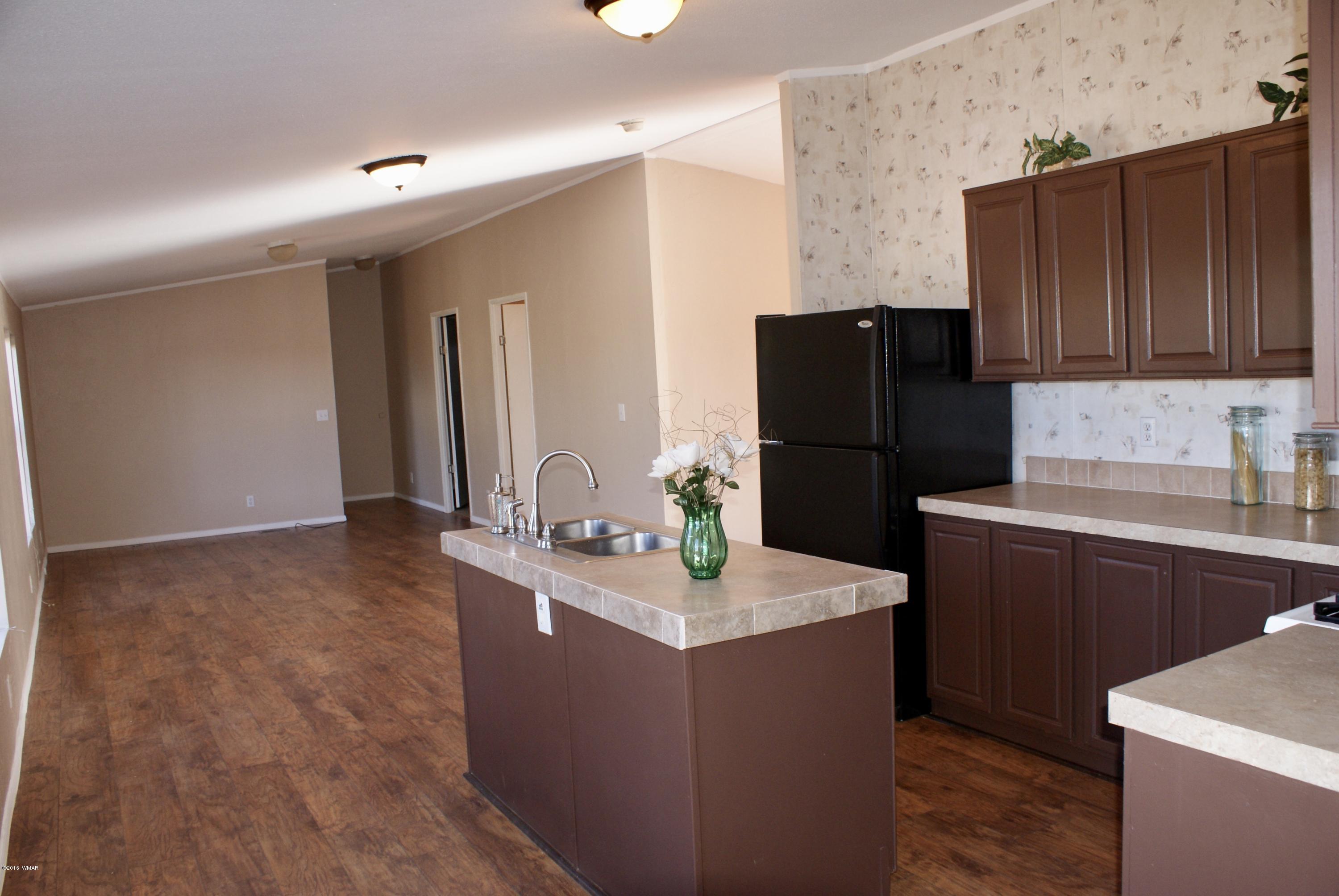 Lot 66 Antelope Vernon, AZ 85940 - Photo 6 of 17 a kitchen with a refrigerator and a stove