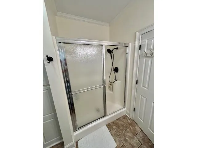 a spacious bathroom with a double vanity sink and mirror