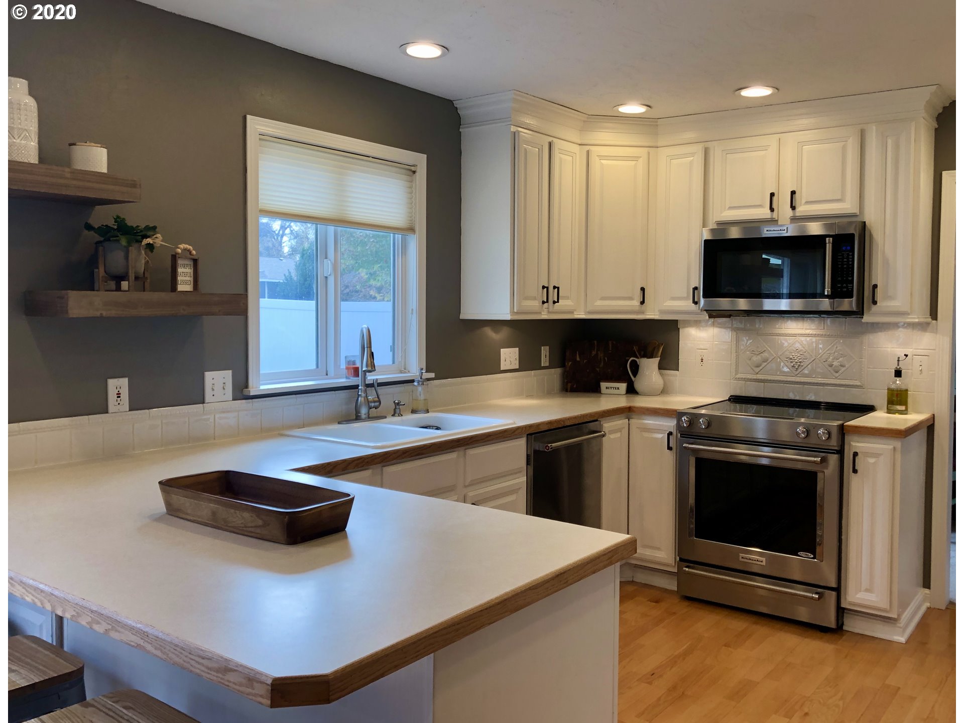1554 Southwest 44th Street Pendleton, OR 97801 - Photo 5 of 22 a kitchen with stainless steel appliances a stove a sink and a microwave