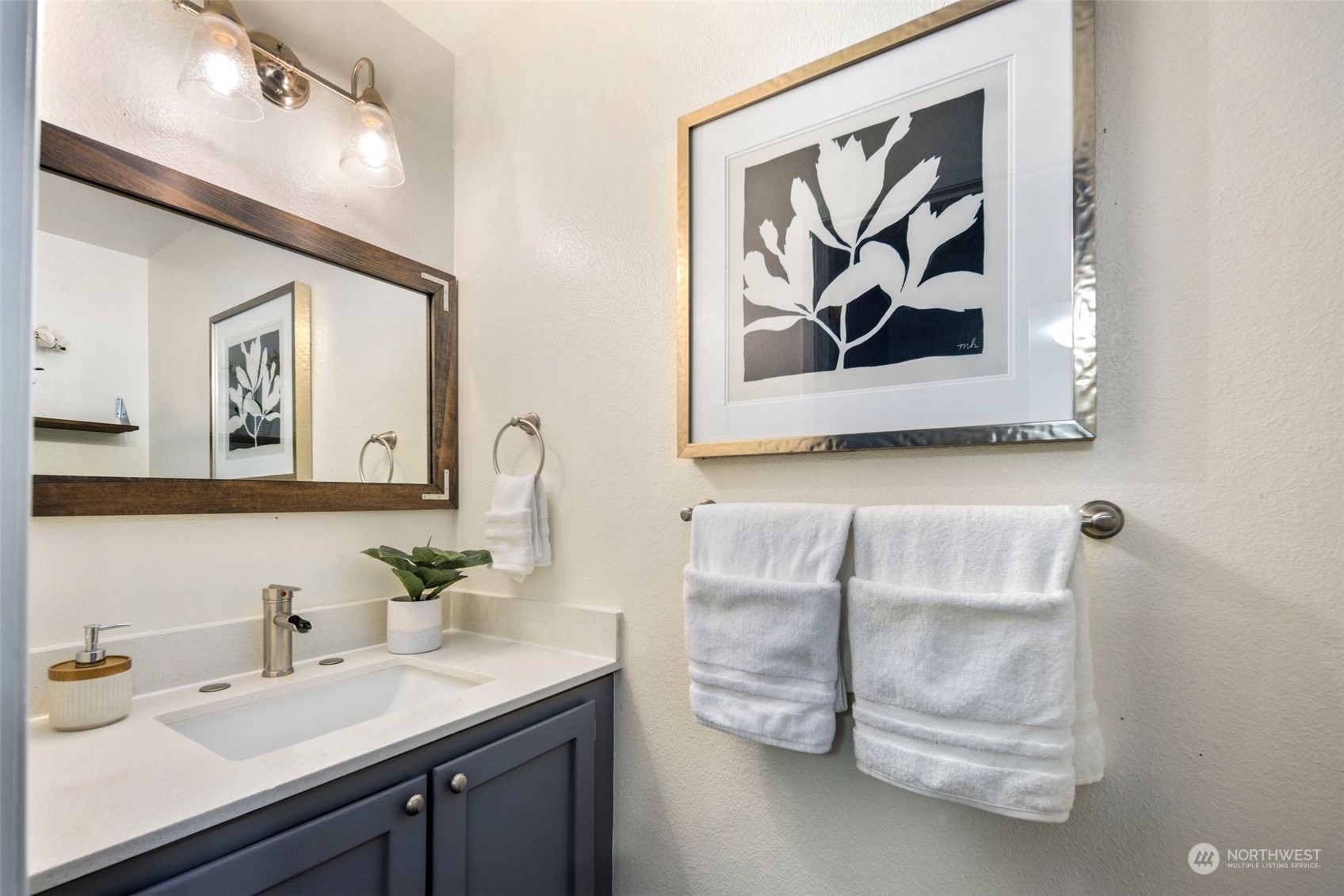 21658 14th Avenue South, Unit A10 Des Moines, WA 98198 - Photo 11 of 39 a bathroom with a sink and a mirror