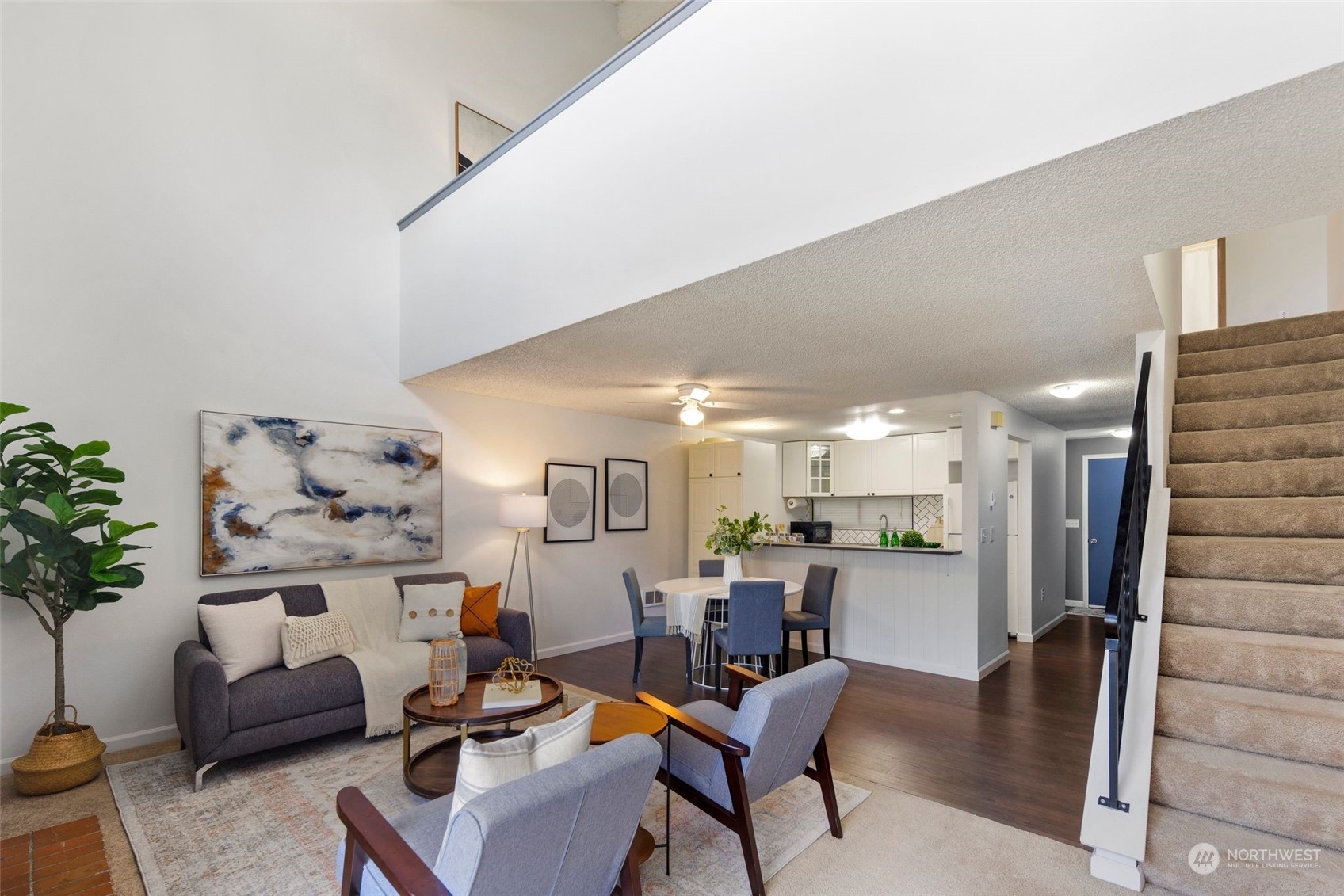 21658 14th Avenue South, Unit A10 Des Moines, WA 98198 - Photo 12 of 39 a living room with furniture and kitchen view