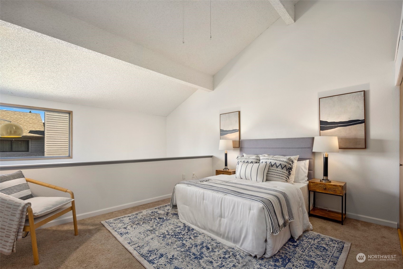 21658 14th Avenue South, Unit A10 Des Moines, WA 98198 - Photo 13 of 39 a bedroom with a bed and lamp