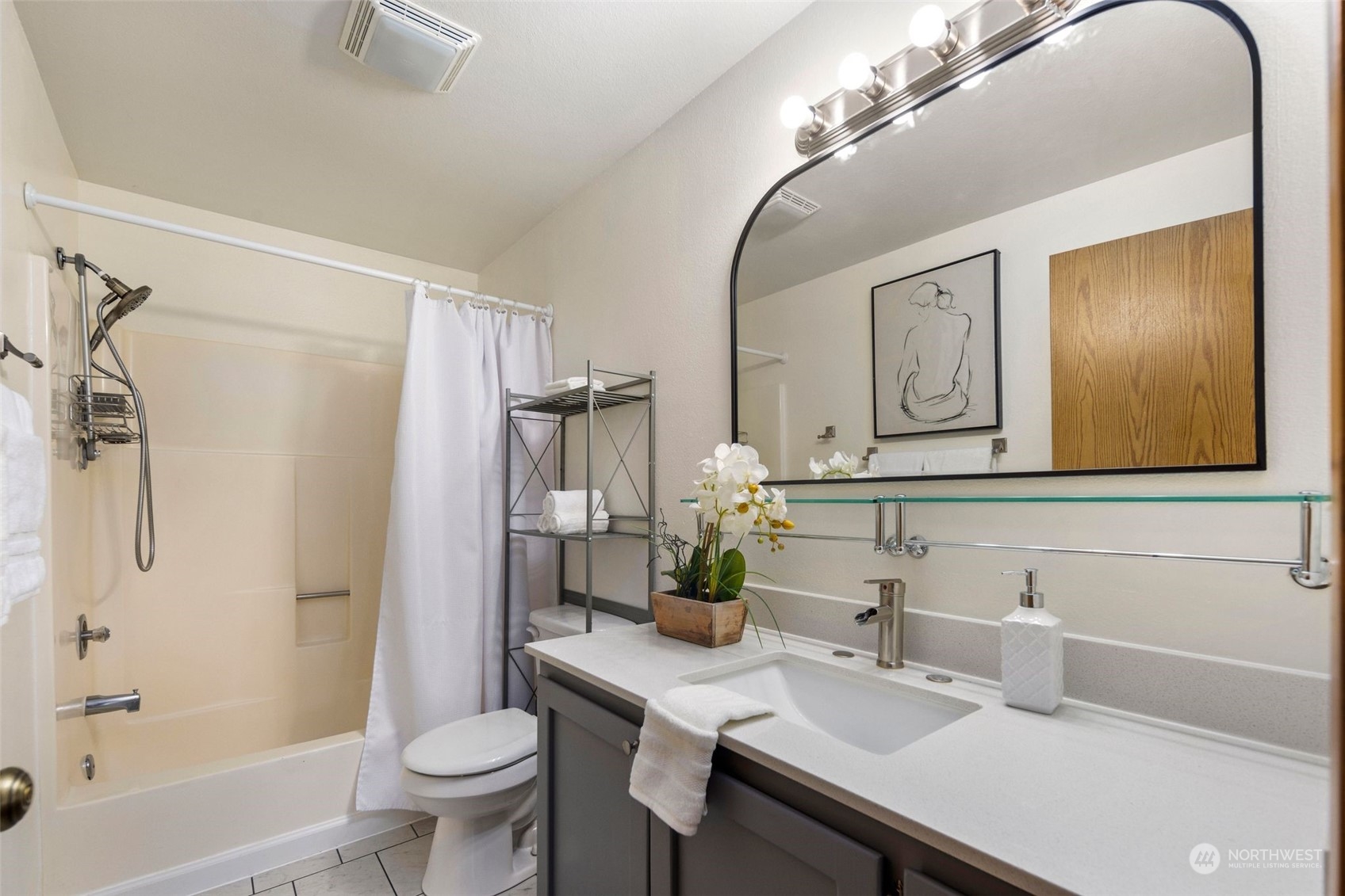 21658 14th Avenue South, Unit A10 Des Moines, WA 98198 - Photo 17 of 39 a bathroom with a sink a toilet and shower