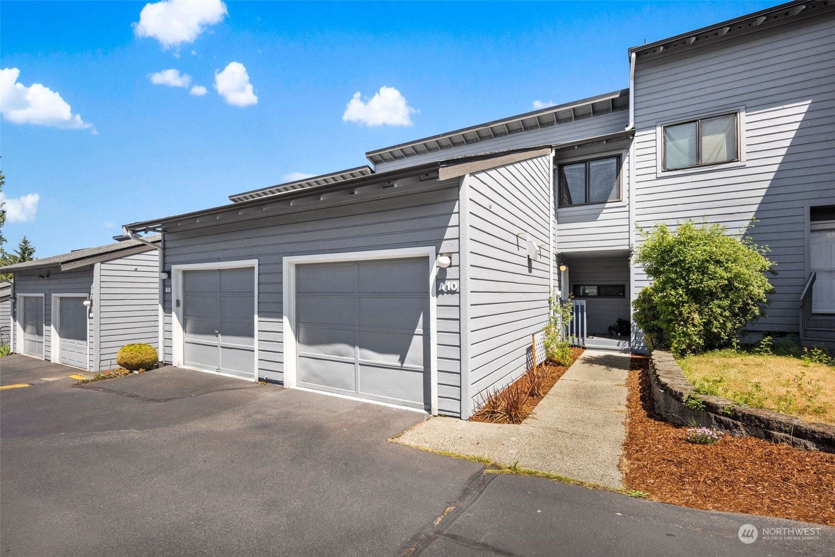 21658 14th Avenue South, Unit A10 Des Moines, WA 98198 - Photo 23 of 39 a view of a house with a patio