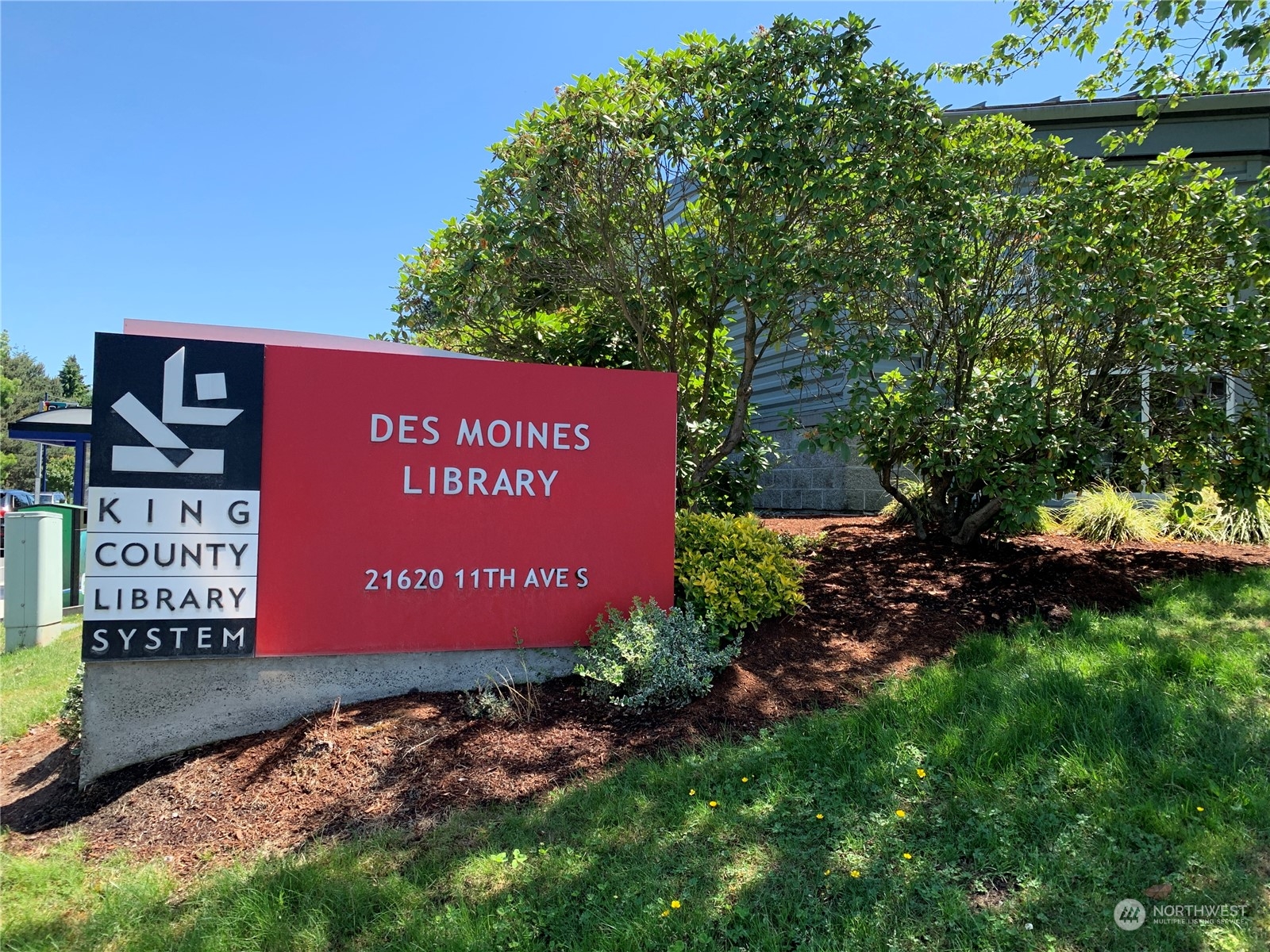 21658 14th Avenue South, Unit A10 Des Moines, WA 98198 - Photo 24 of 39 a sign on the side of the road