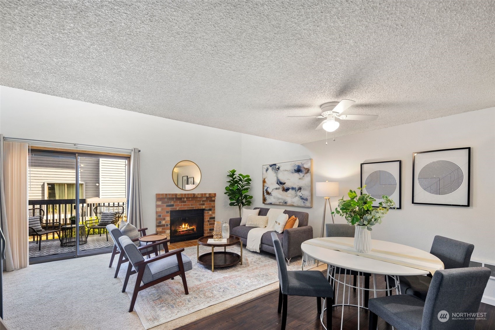 21658 14th Avenue South, Unit A10 Des Moines, WA 98198 - Photo 3 of 39 a living room with furniture a fireplace and a table