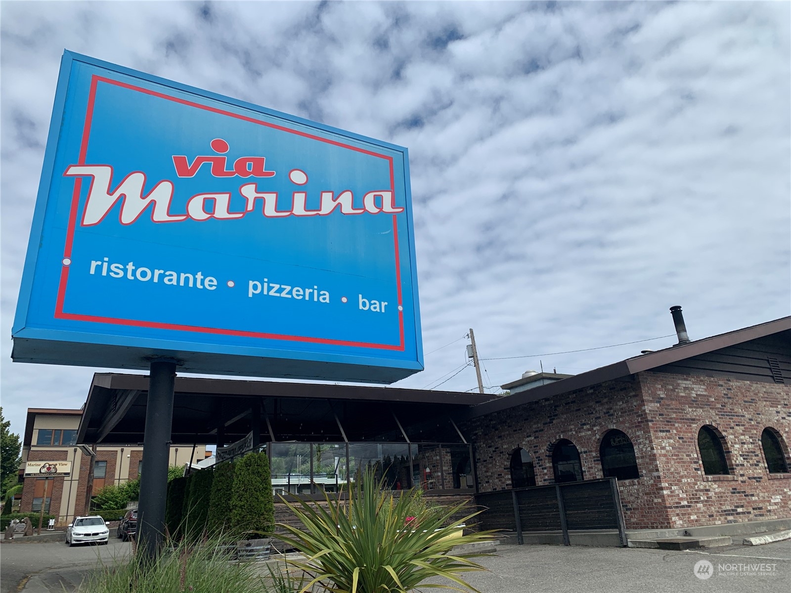 21658 14th Avenue South, Unit A10 Des Moines, WA 98198 - Photo 32 of 39 a sign on the wall of building