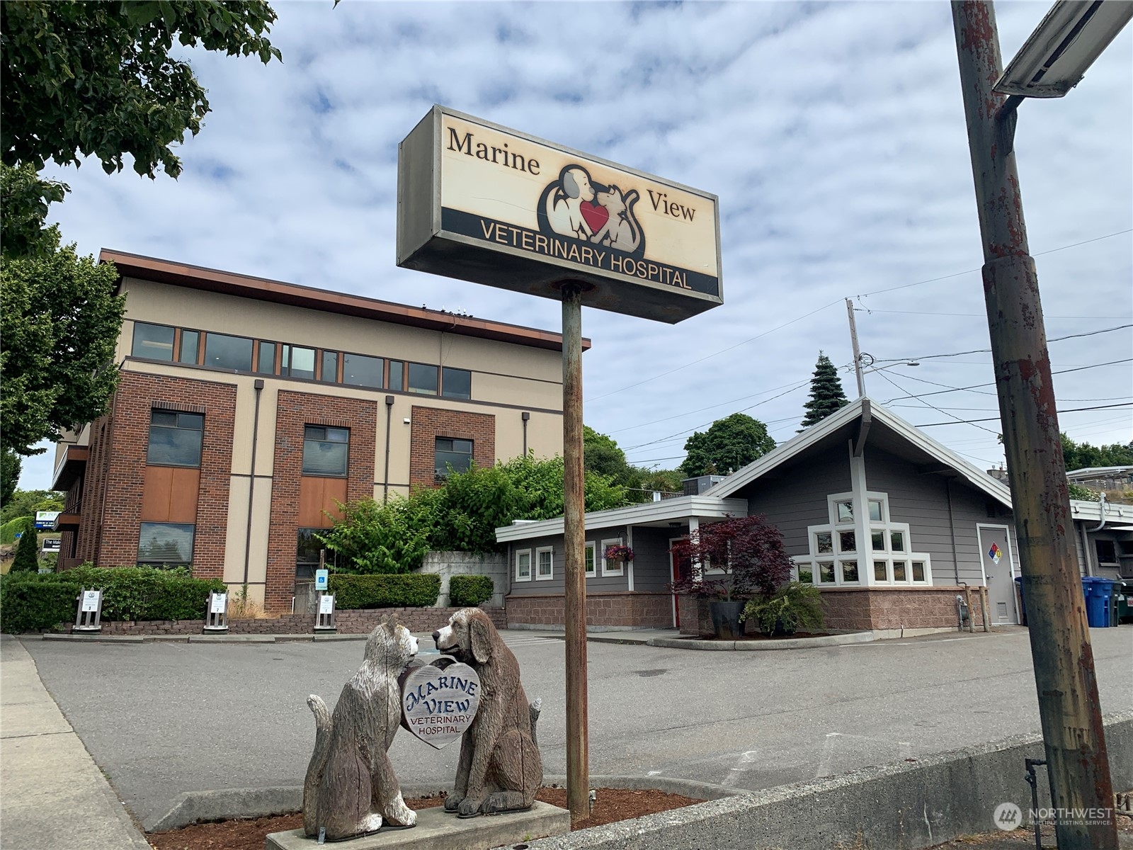 21658 14th Avenue South, Unit A10 Des Moines, WA 98198 - Photo 33 of 39 a front view of a house with parking area