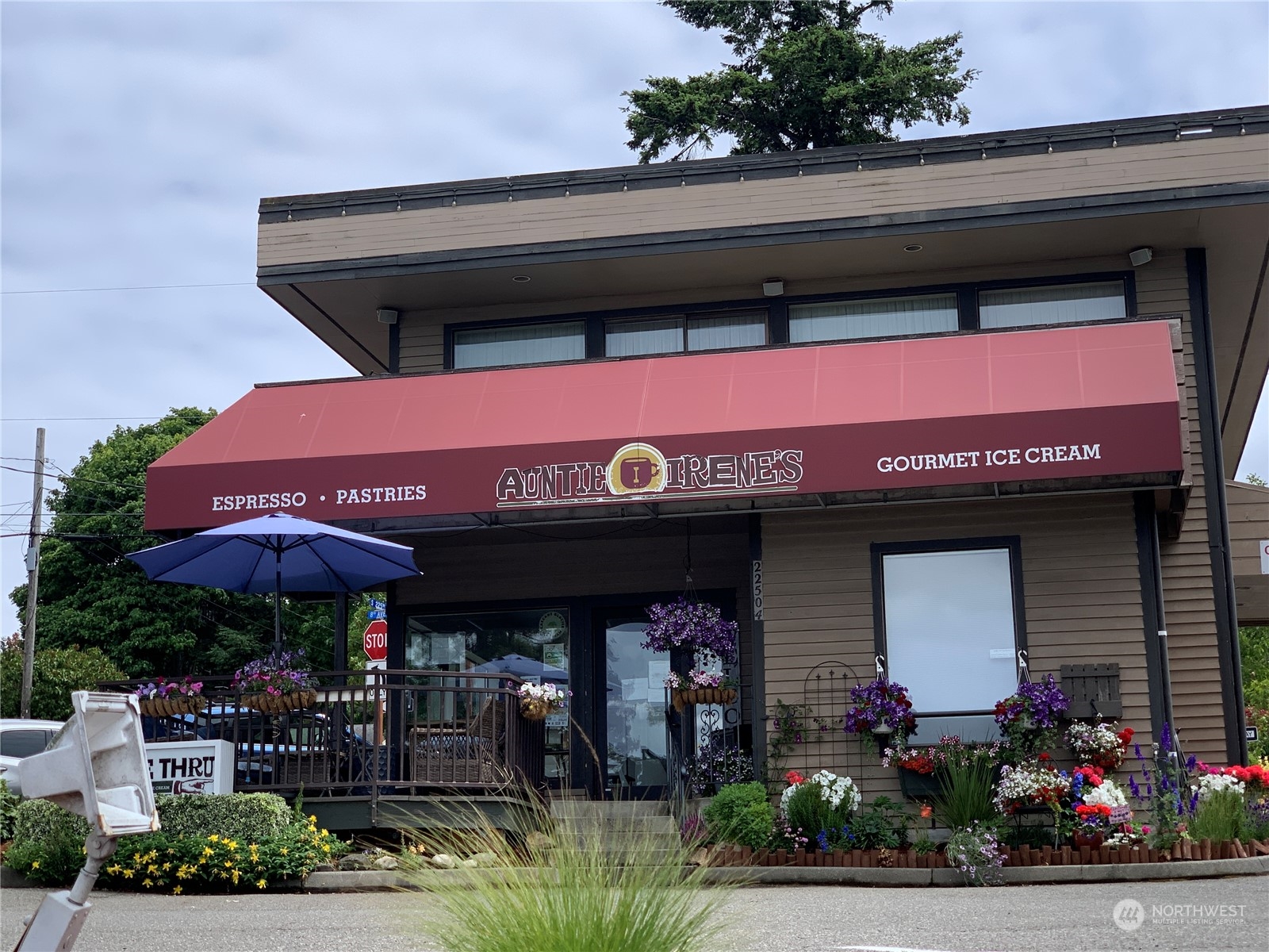 21658 14th Avenue South, Unit A10 Des Moines, WA 98198 - Photo 34 of 39 a front view of a building with umbrellas