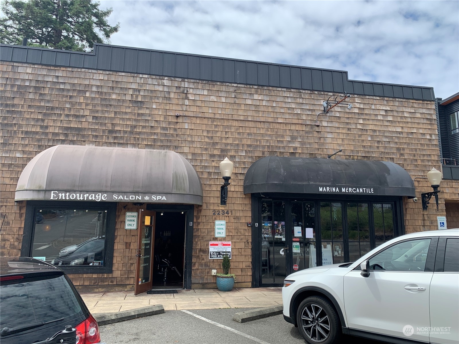 21658 14th Avenue South, Unit A10 Des Moines, WA 98198 - Photo 36 of 39 a front view of a house with parking space