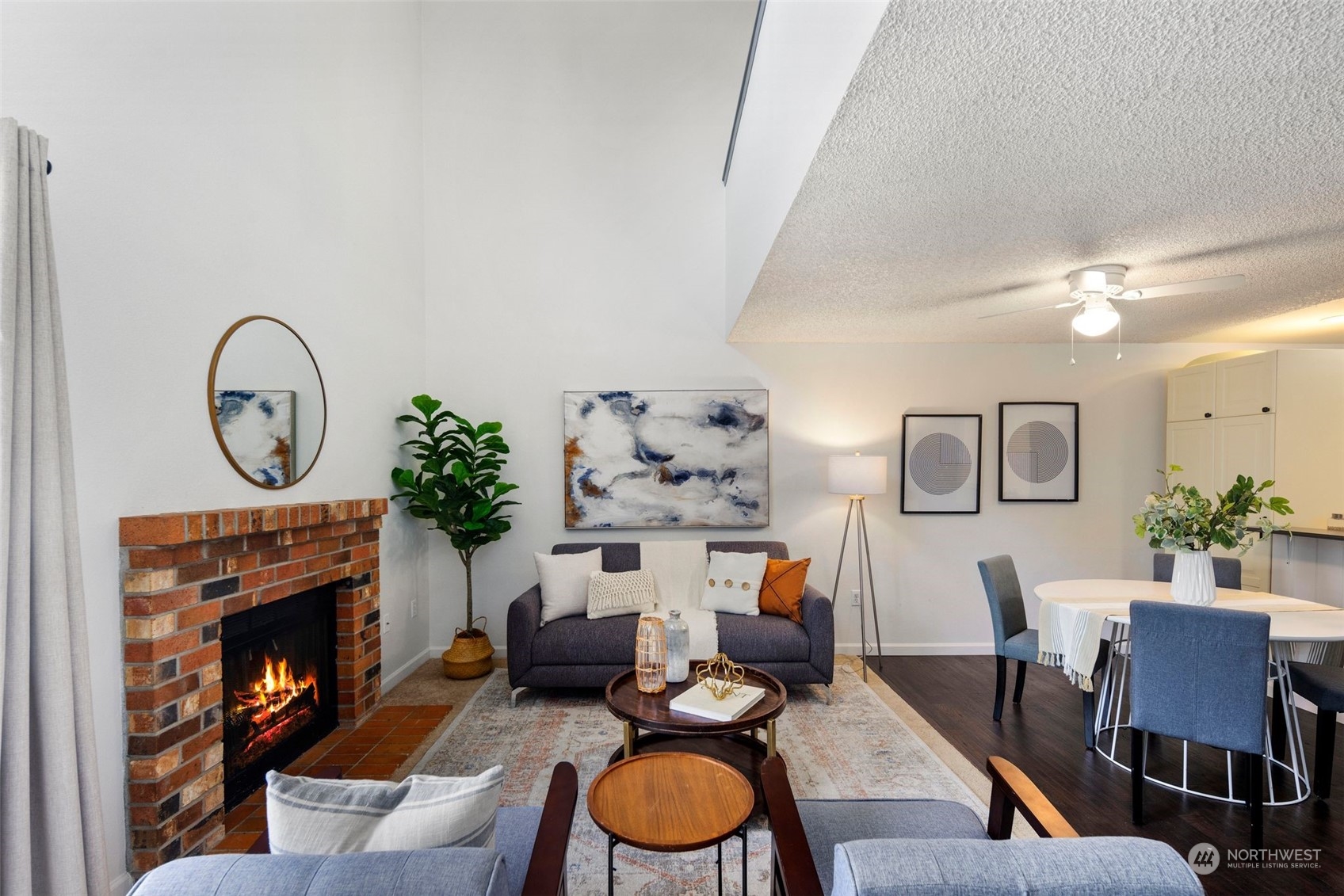 21658 14th Avenue South, Unit A10 Des Moines, WA 98198 - Photo 4 of 39 a living room with furniture a fireplace and a flat screen tv