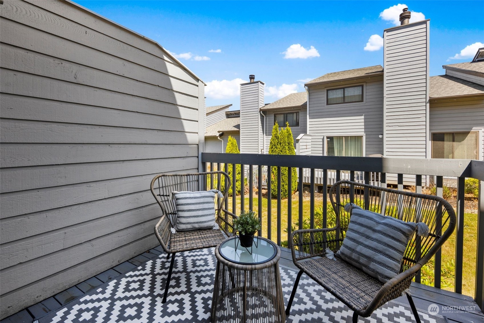 21658 14th Avenue South, Unit A10 Des Moines, WA 98198 - Photo 5 of 39 a wooden bench sitting in front of a house