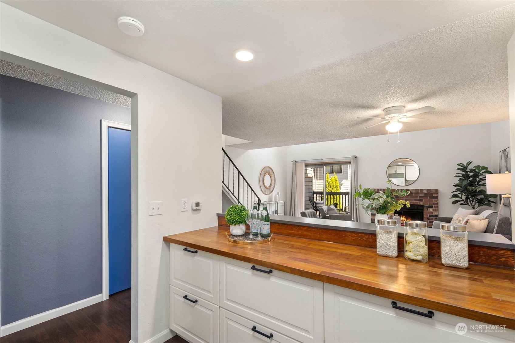 21658 14th Avenue South, Unit A10 Des Moines, WA 98198 - Photo 9 of 39 a room with lots of counter space and a mirror