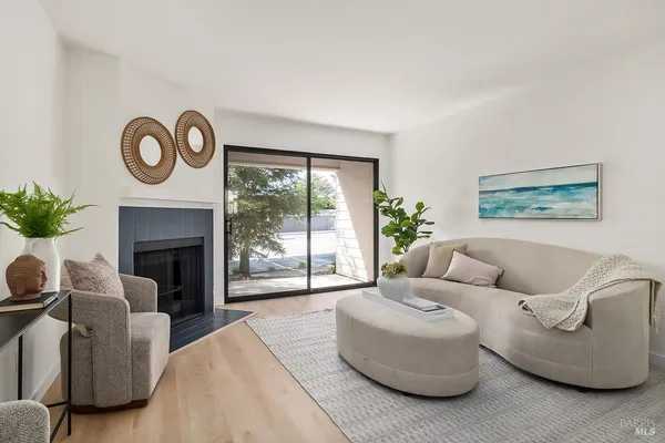 a living room with furniture and a fireplace