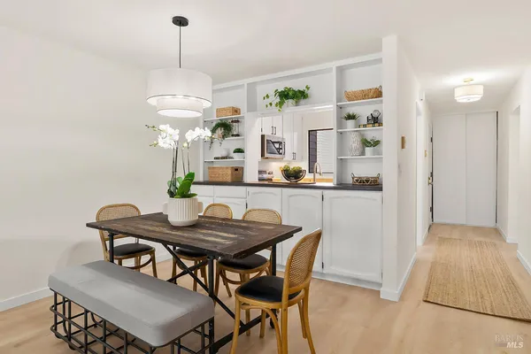 a dining room with furniture and window
