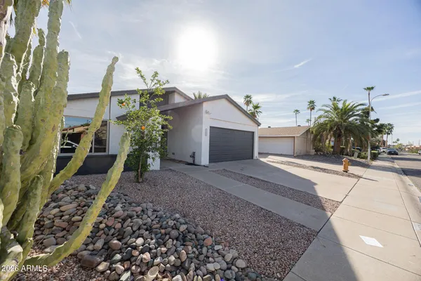 a house view with a garden space