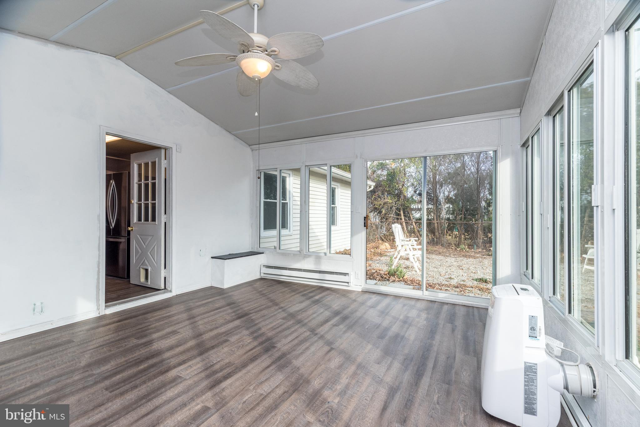 1000 Stephen Avenue Croydon, PA 19021 - Photo 15 of 20 a view of an empty room with a window and wooden floor