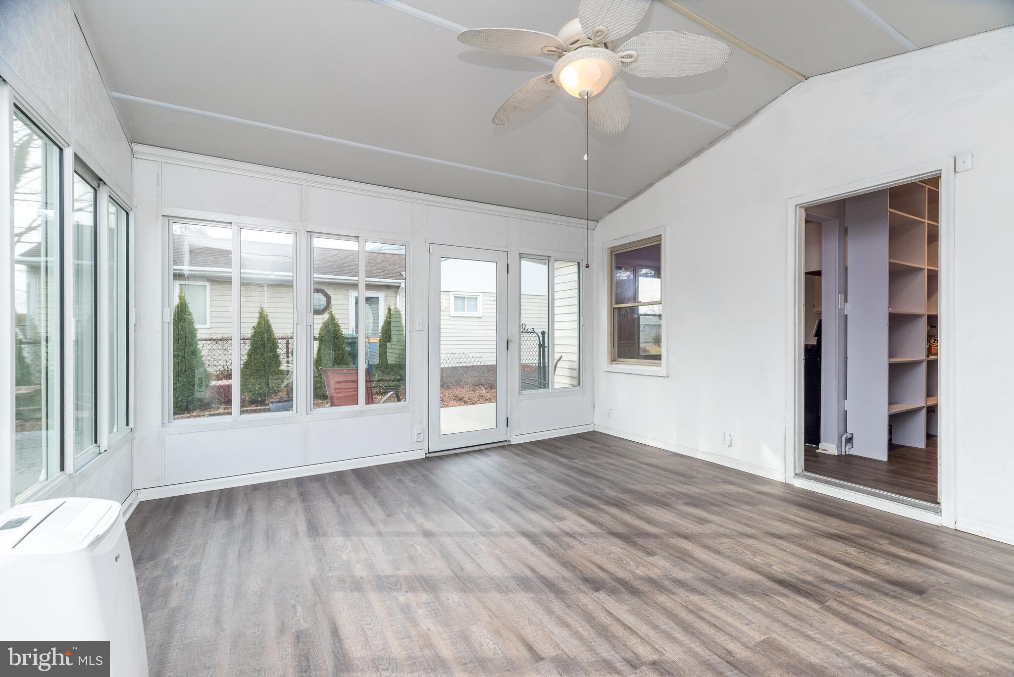 1000 Stephen Avenue Croydon, PA 19021 - Photo 16 of 20 a view of an empty room with wooden floor and a window