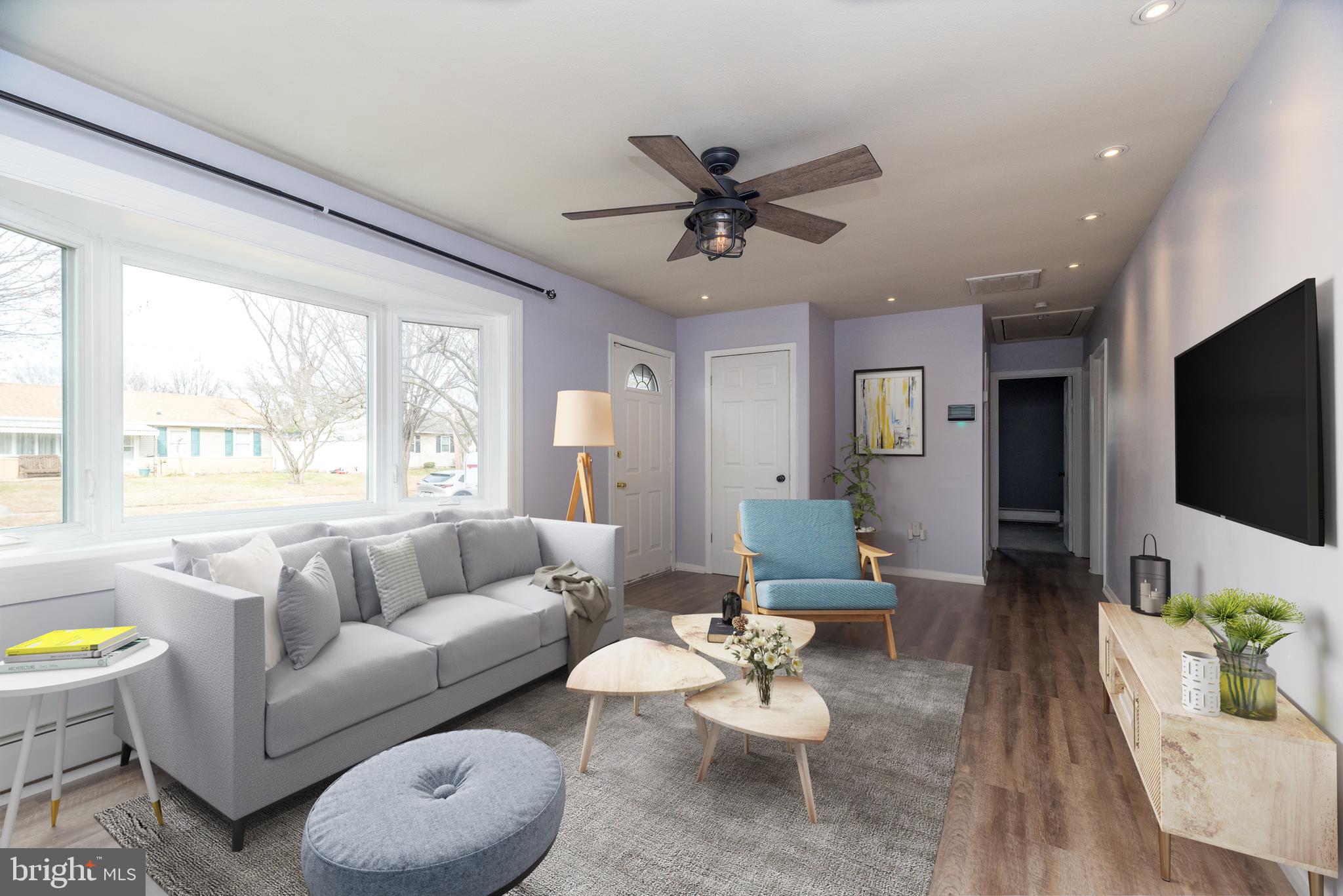 1000 Stephen Avenue Croydon, PA 19021 - Photo 2 of 20 a living room with furniture and a flat screen tv