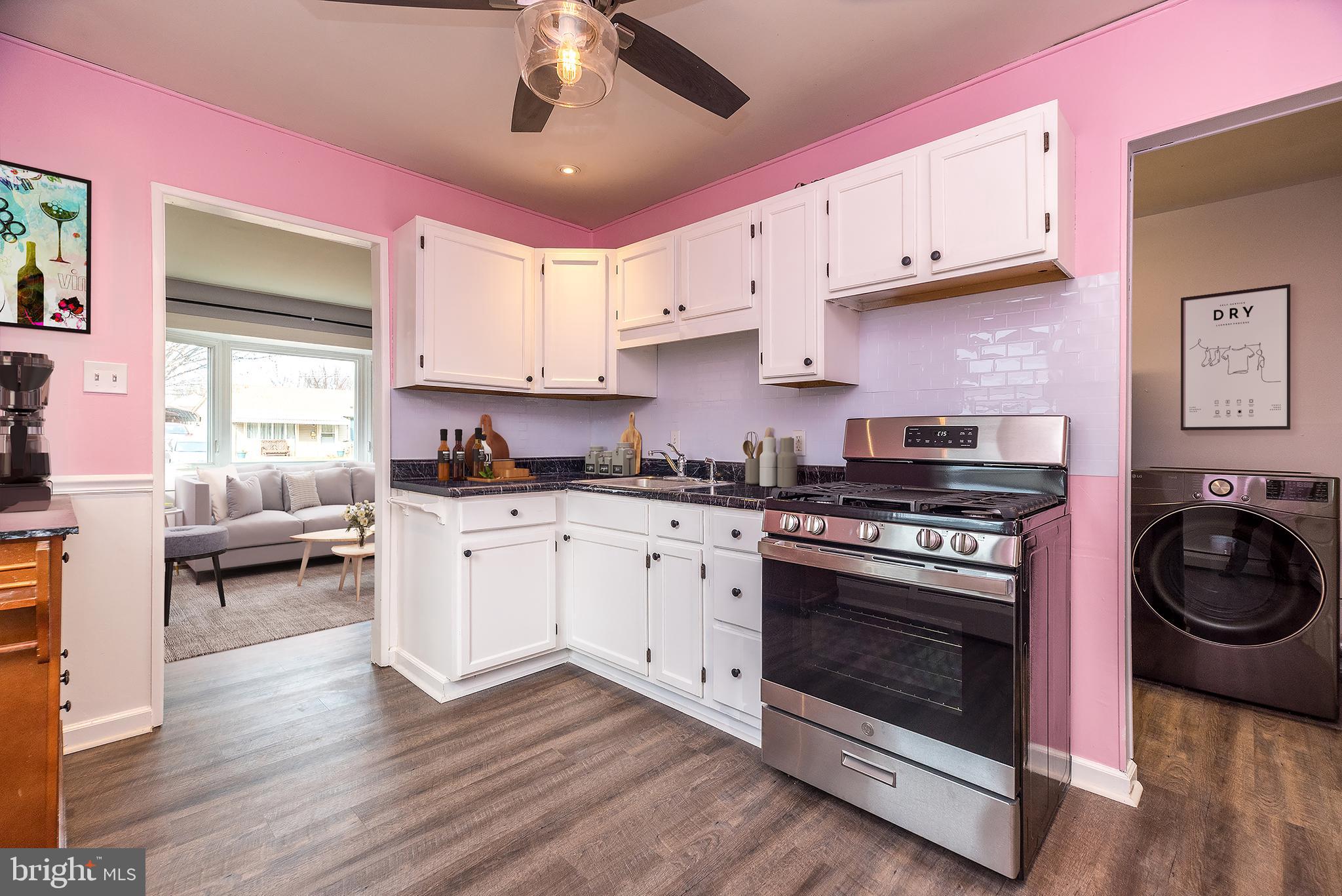 1000 Stephen Avenue Croydon, PA 19021 - Photo 4 of 20 a kitchen with a stove cabinets and wooden floor