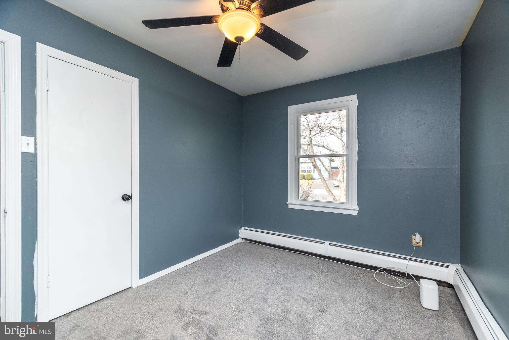 1000 Stephen Avenue Croydon, PA 19021 - Photo 7 of 20 a view of an empty room with window and chandelier fan
