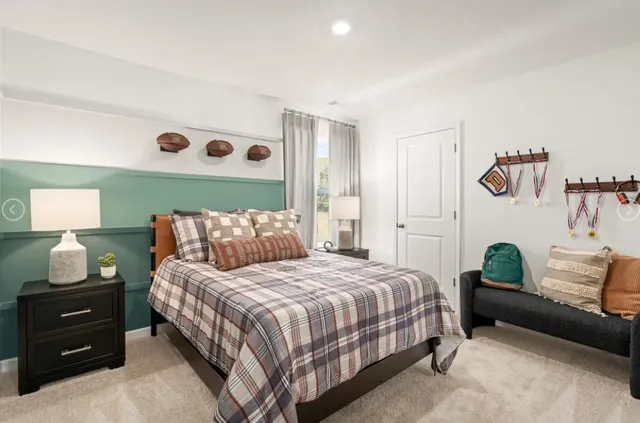 a bedroom with a bed and a couch