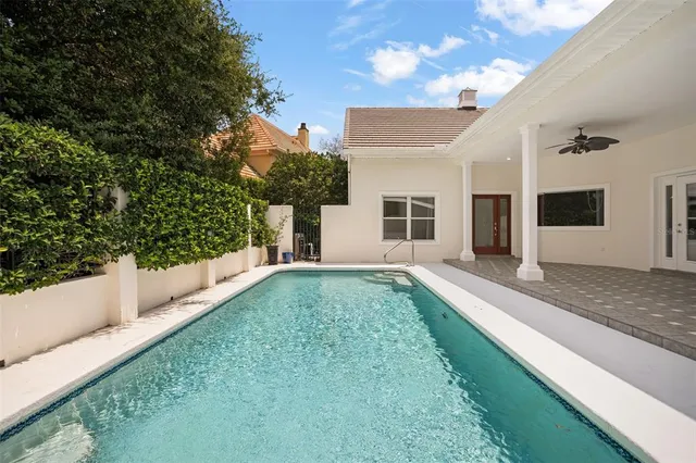 a view of a house with a backyard