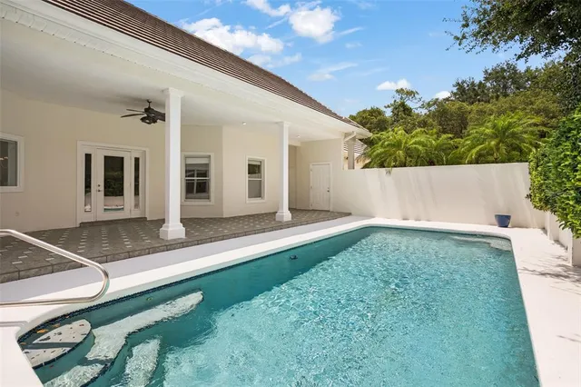 a view of a house with a backyard