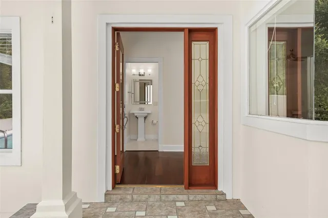 a view of a house with a backyard