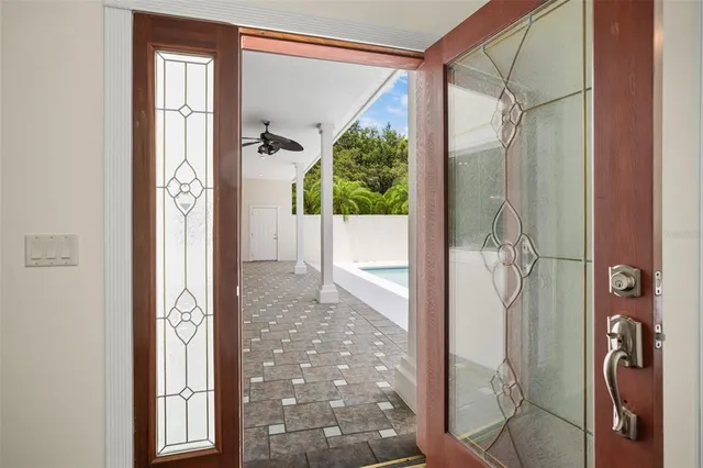 a view of dining room with floor to ceiling window and wooden floor