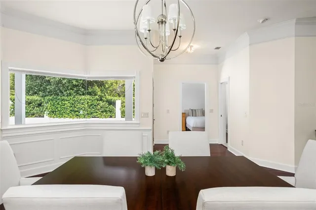 a kitchen with kitchen island a counter top space a sink stainless steel appliances and cabinets